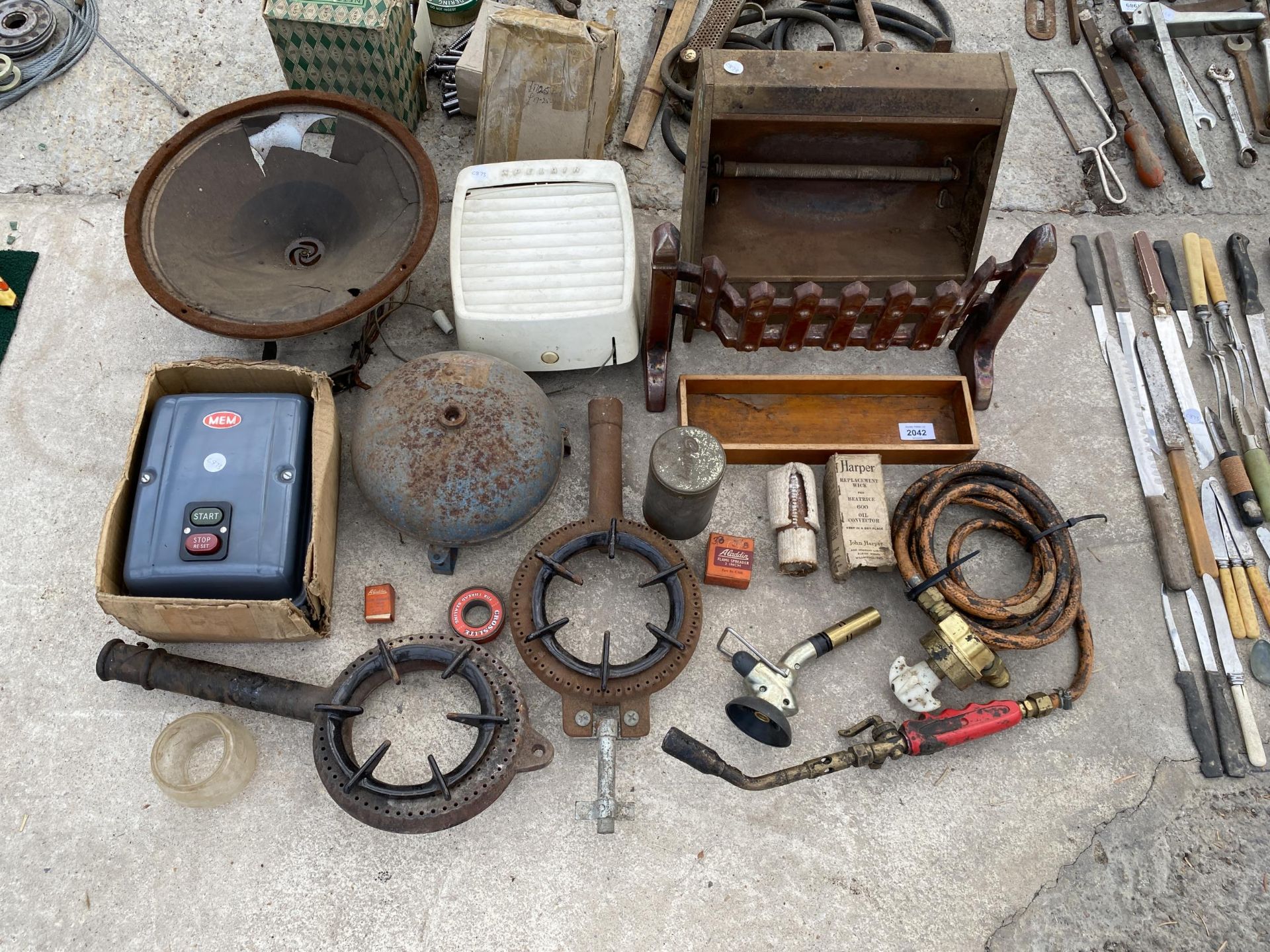 AN ASSORTMENT OF ITEMS TO INCLUDE BURNER RINGS, A FIRE FRONT AND AN ELECTRIC START SWITCH ETC