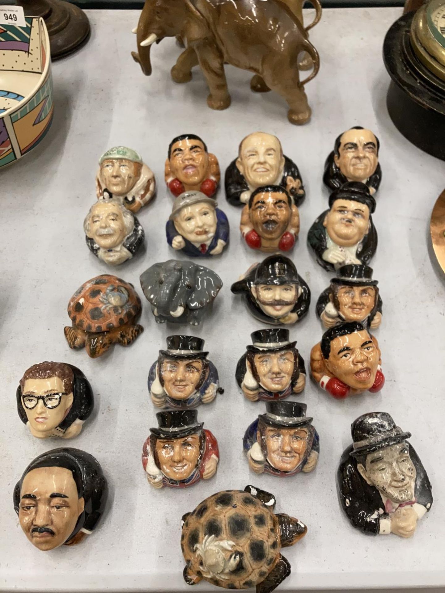 A LARGE COLLECTION OF CERAMIC 'FACE POTS' TO INCLUDE NELLIE, MARTIN LUTHER KING, MUHAMMAD ALI,