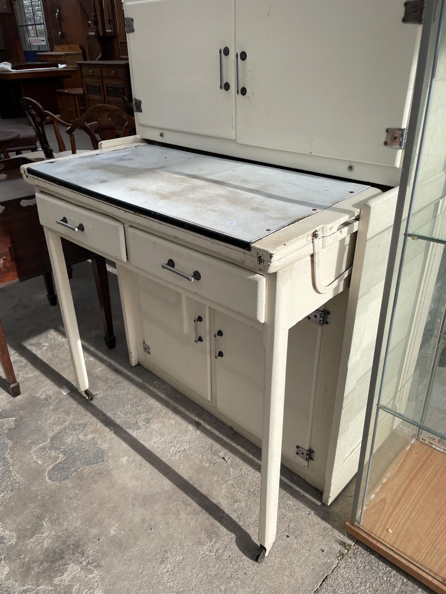 A 1950'S METALWARE KITCHEN CABINET WITH PULL-OUT ENAMEL WORK SURFACE, ON LEGS WITH CASTERS, WITH - Image 2 of 5