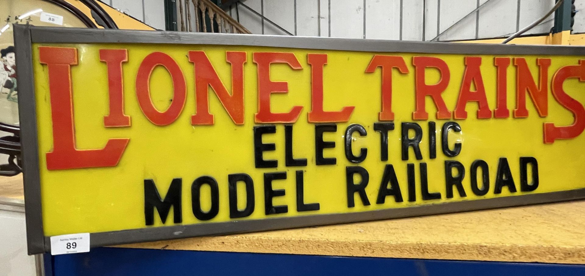 A LIONEL TRAINS ELECTRIC MODEL RAILROAD ILLUMINATED BOX SIGN