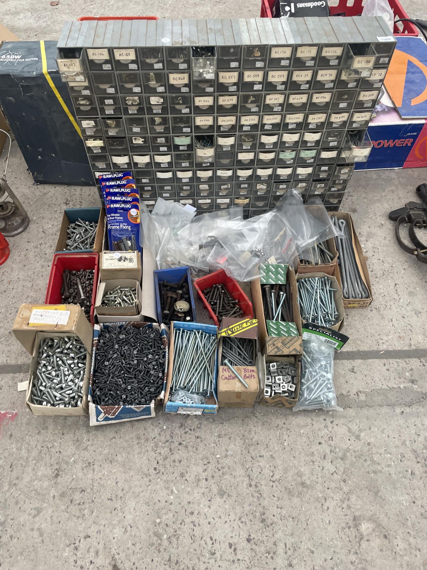 A LARGE ASSORTMENT OF HARDWARE TO INCLUDE BOLTS,SCREWS AND NAILS ETC