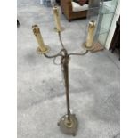 A BRASS STANDARD LAMP WITH THREE BRANCHES, ON REEDED COLUMN WITH ROUND BASE HAVING CLAW FEET