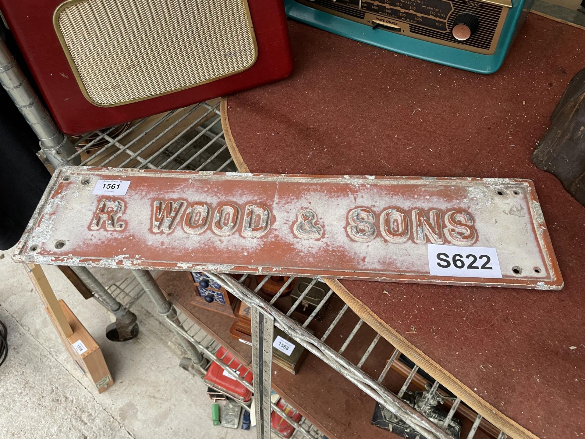 A CAST ALLOY 'R WOOD & SONS' SIGN