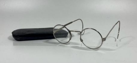 A PAIR OF VINTAGE WHITE METAL SPECTACLES IN ORIGINAL LEATHER CASE