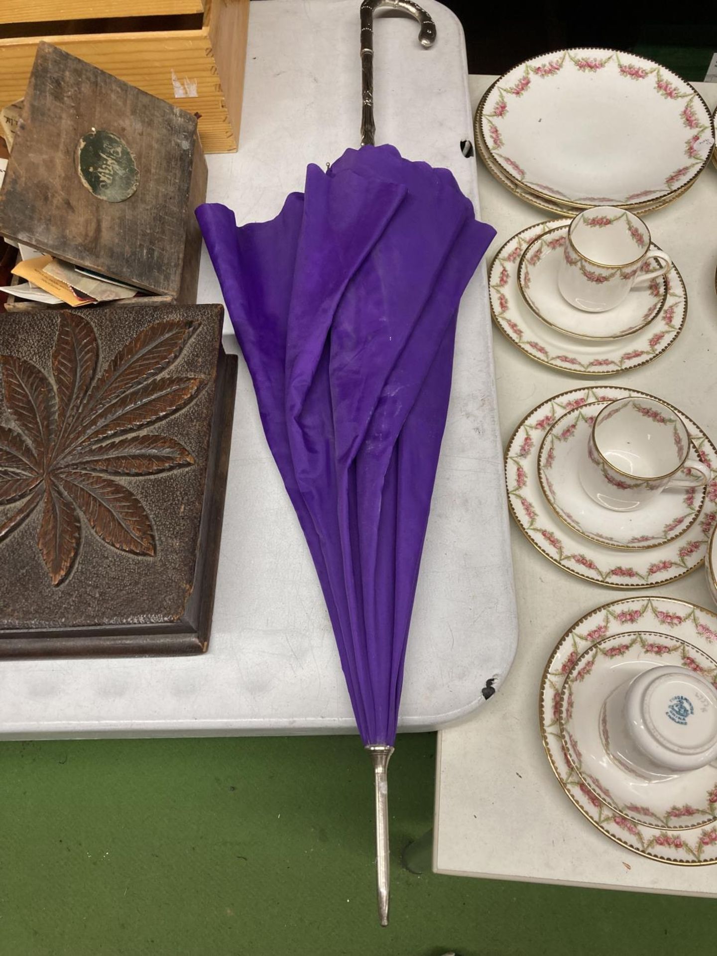 A PURPLE VINTAGE STYLE UMBRELLA WITH WHITE METAL 'BAMBOO' PATTERN HANDLE