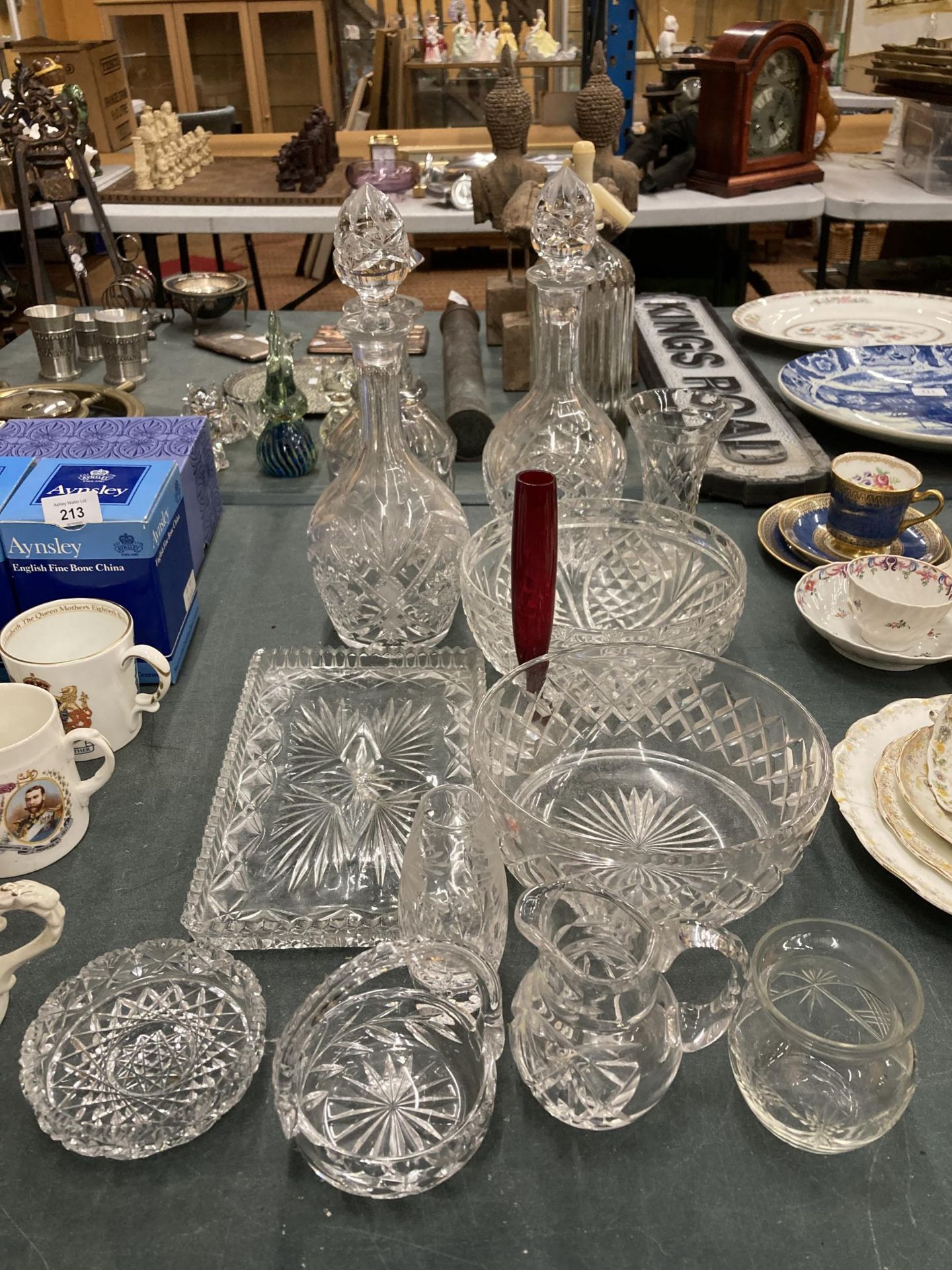 A COLLECTION OF CUT GLASS ITEMS - DECANTERS, BOWLS ETC