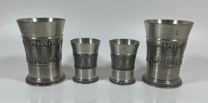 A SET OF FOUR SKS ZINN 95% PEWTER DRINKING GLASSES, HEIGHT OF LARGEST PAIR 9 CM