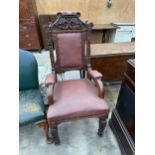 A VICTORIAN MAHOGANY UPHOLSTERED THRONE CHAIR WITH FOLIATE CARVINGS, ON TAPERED LEGS AND SUPPORTS