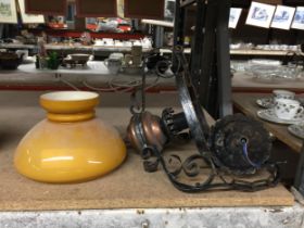 A VINTAGE METAL AND AMBER GLASS LIGHT FITTING