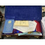 A MASONIC CASE WITH VINTAGE MASONIC APRONS, LITERATURE, ETC