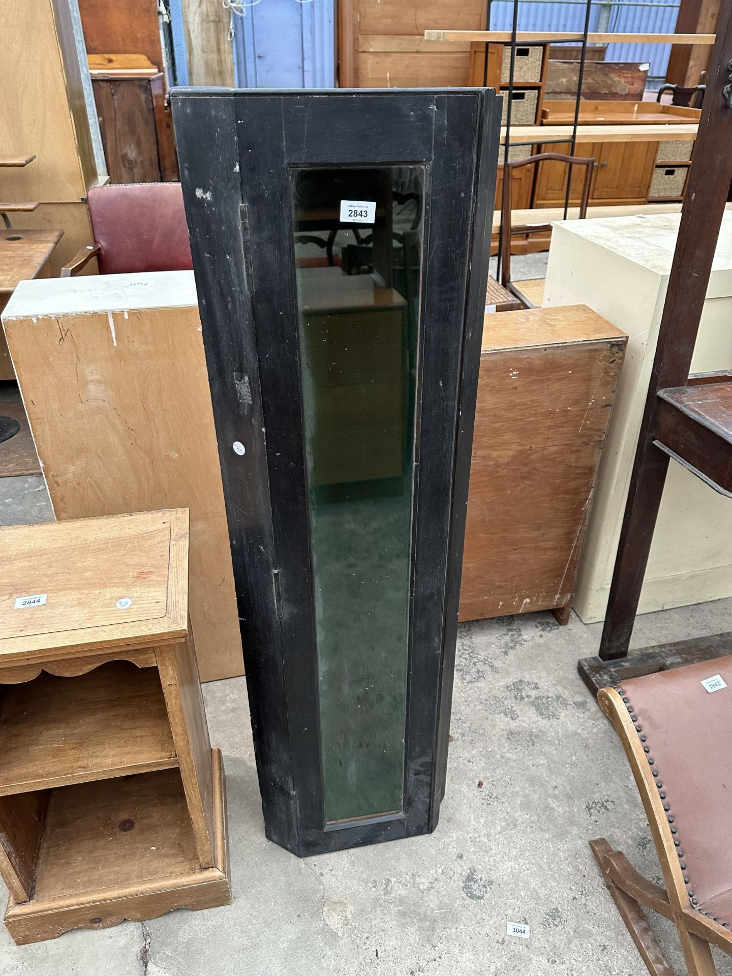 A BLACK PAINTED CORNER CABINET WITH GLASS DOOR AND GREEN BAIZE LINING, 14.5" WIDE