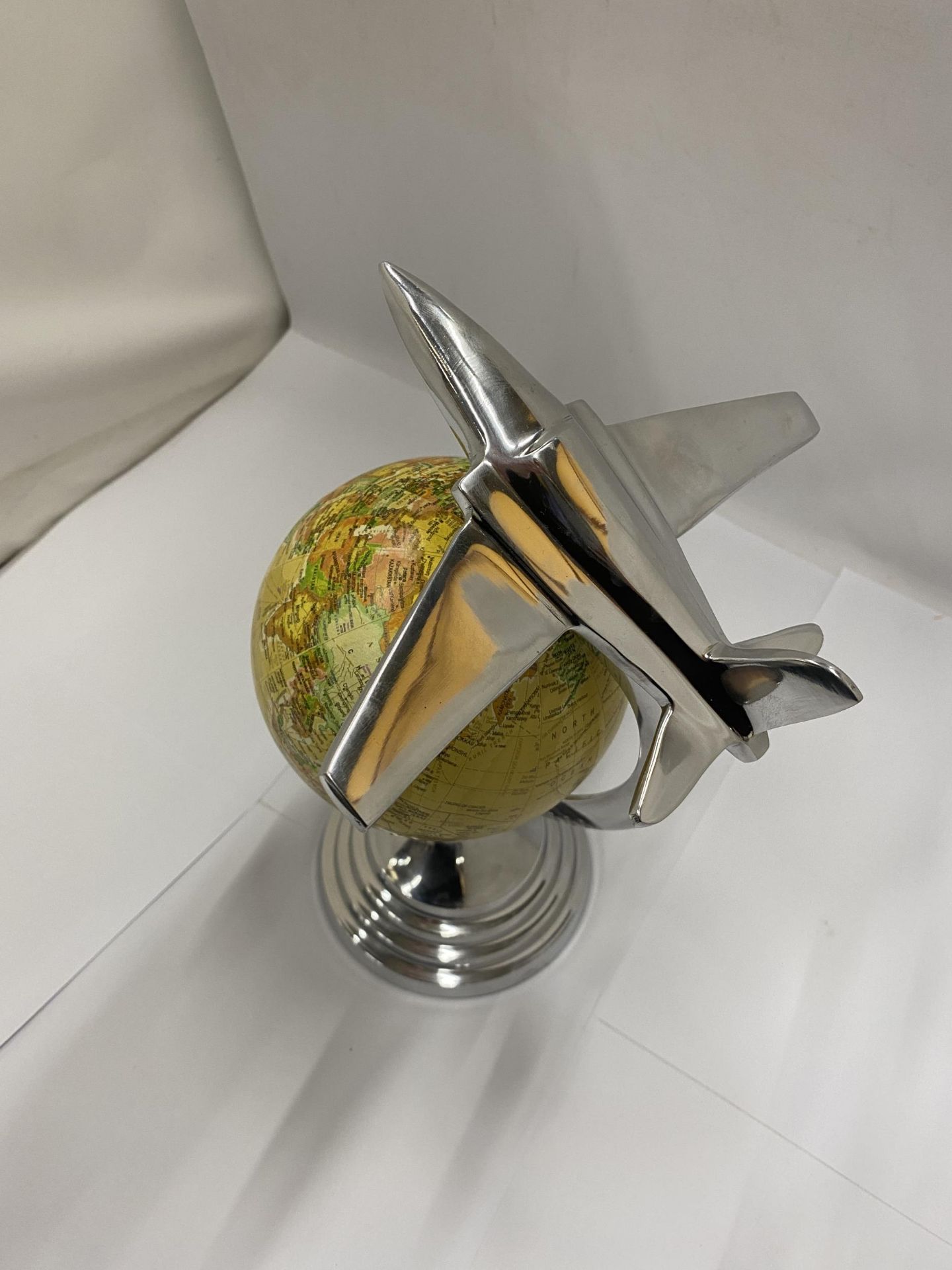 A DESK GLOBE WITH CHROME EFFECT BASE AND AEROPLANE DESIGN - Image 2 of 3