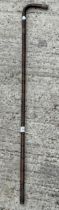 A VINTAGE WOODEN WALKING STICK WITH HALLMARKED SILVER COLLARS