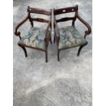 A PAIR OF REGENCY STYLE MAHOGANY CARVER CHAIRS