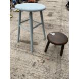 A VINTAGE THREE LEGGED MILKING STOOL AND A FURTHER WOODEN STOOL