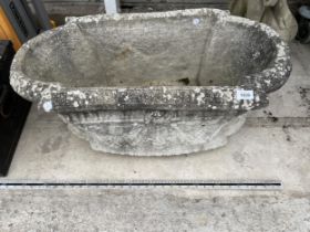 A CAST CONCERETE GARDEN PLANTER