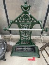 A VINTAGE PAINTED CAST IRON UMBRELLA STAND WITH DRIP TRAY