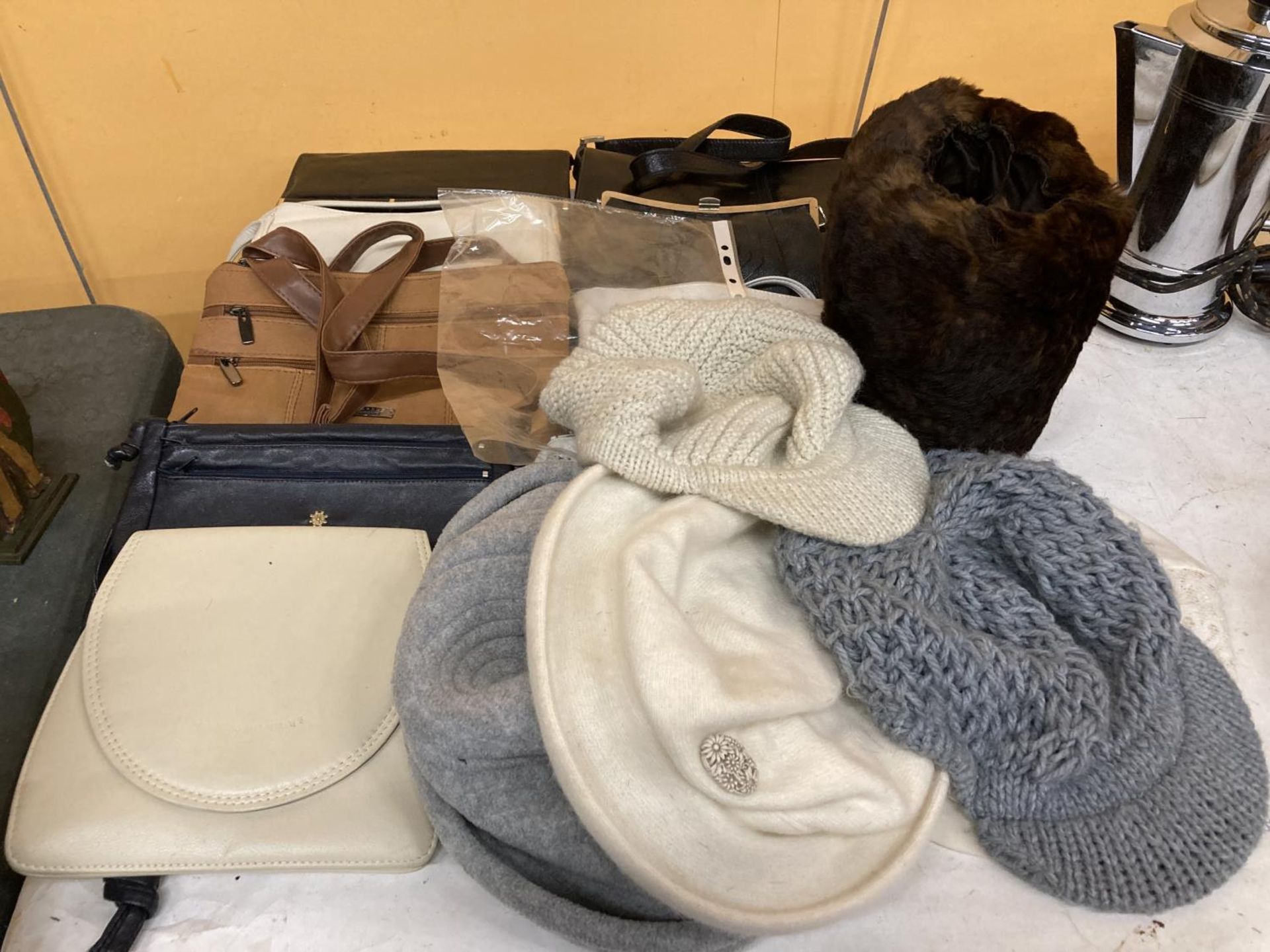 A QUANTITY OF HANDBAGS AND HATS