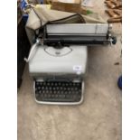 A RETRO REMINGTON TYPEWRITER WITH COVER