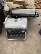 A RETRO REMINGTON TYPEWRITER WITH COVER