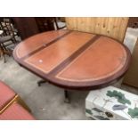 A MAHOGANY REGENCY STYLE EXTENDING PEDESTAL DINING TABLE ON BRASS CLAW FEET WITH BRASS CLAW FEET, 42