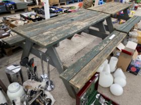 A WOODEN PICNIC BENCH