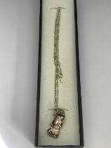 A BOXED SILVER GOLF BAG NECKLACE