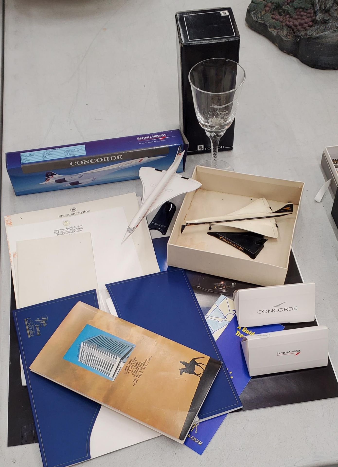 A COLLECTION OF CONCORDE 'FLIGHTS OF FANTASY' ITEMS TO INCLUDE TWO MODELS, A BOXED WINE GLASS,