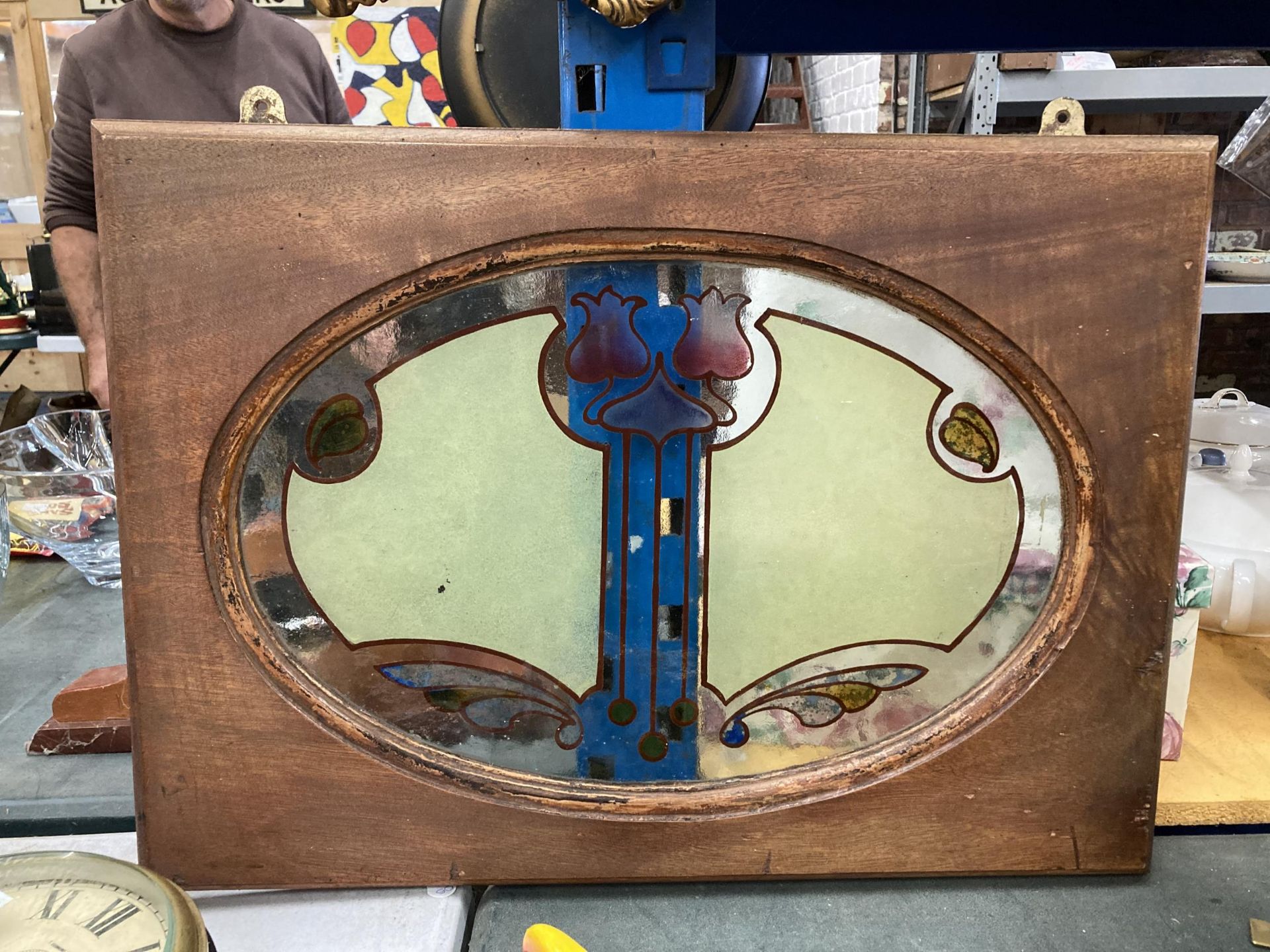 A WOODEN FRAMED ART NOUVEAU DESIGN GLASS PANEL