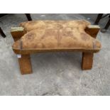 A LEATHER CAMEL STOOL