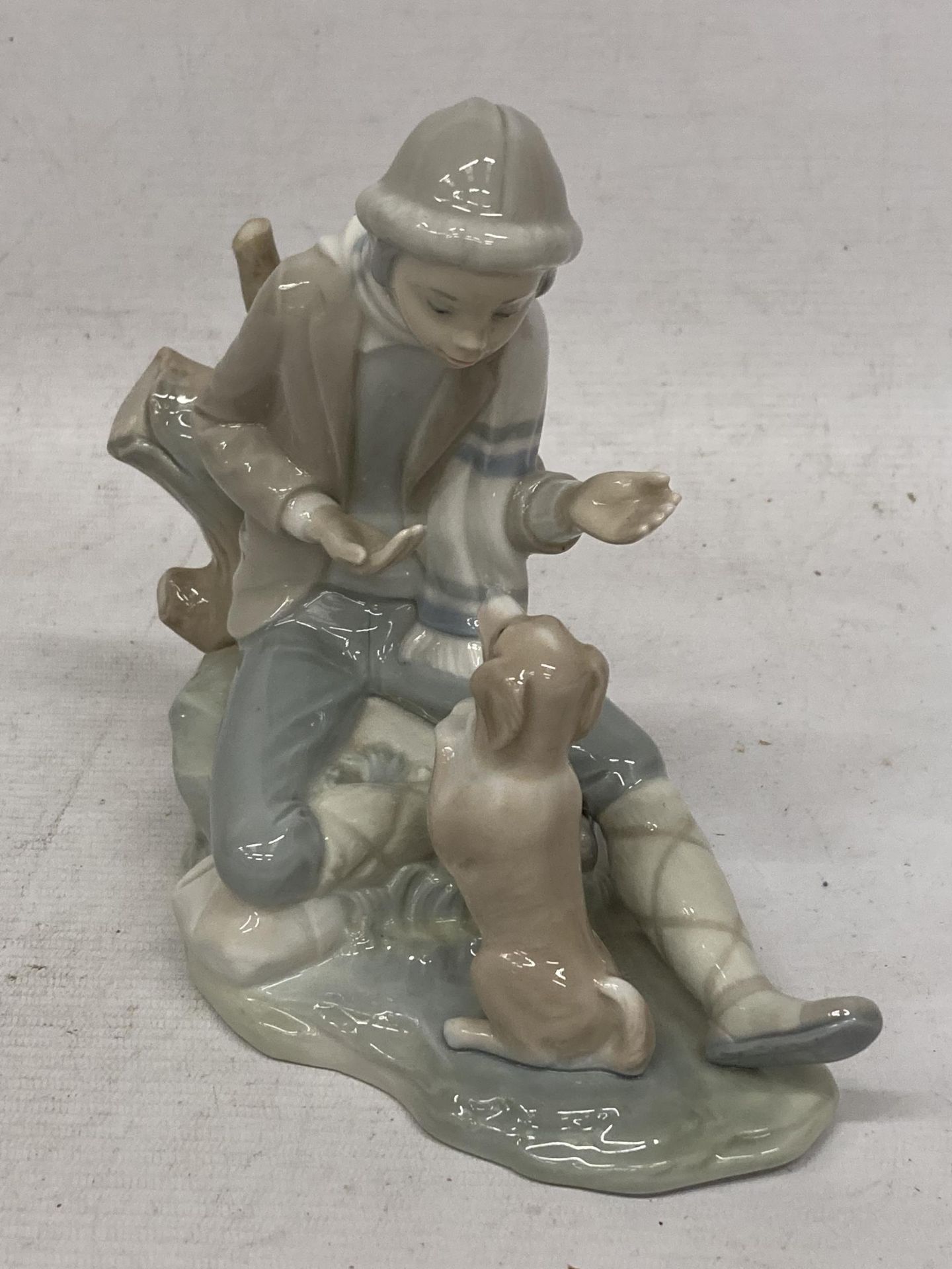 A NAO LLADRO FIGURE OF A BOY WITH DOG - Image 2 of 4