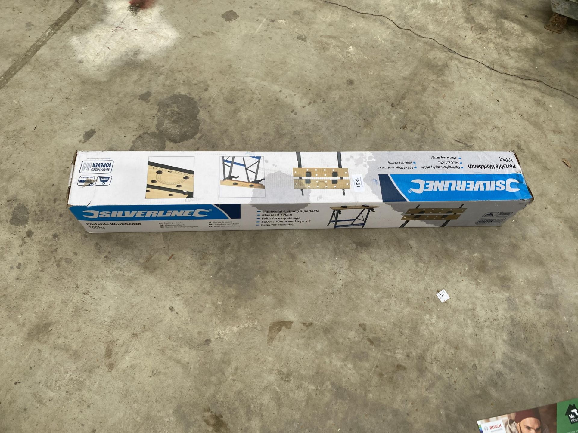 A NEW AND BOXED SILVERLINE PORTABLE WORKBENCH
