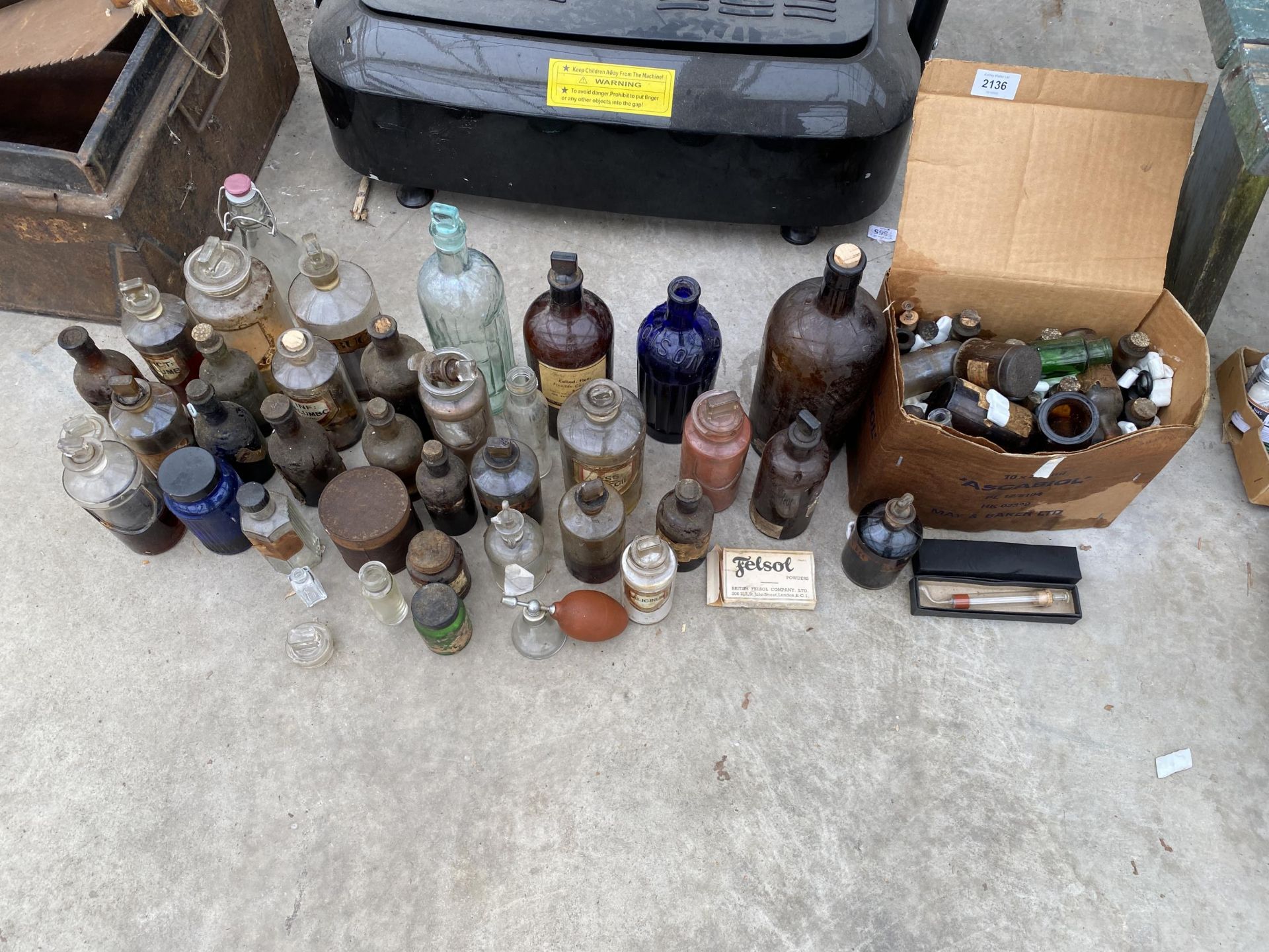 AN ASSORTMENT OF VINTAGE GLASS MEDICINE BOTTLES