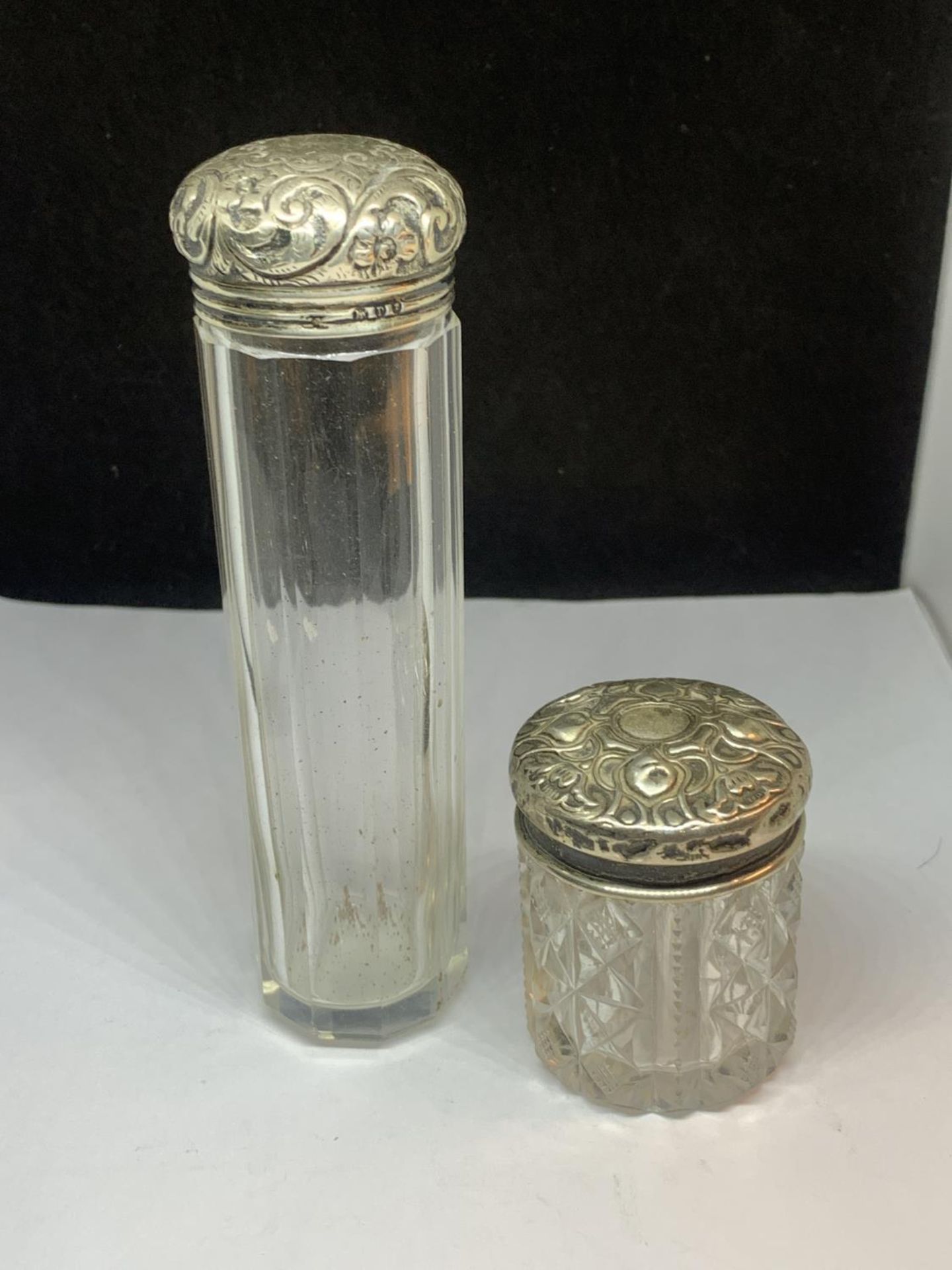 TWO VINTAGE GLASS JARS WITH HALLmaRKED SILVER TOPS ONE BIRMINGHAM AND ONE LONDON