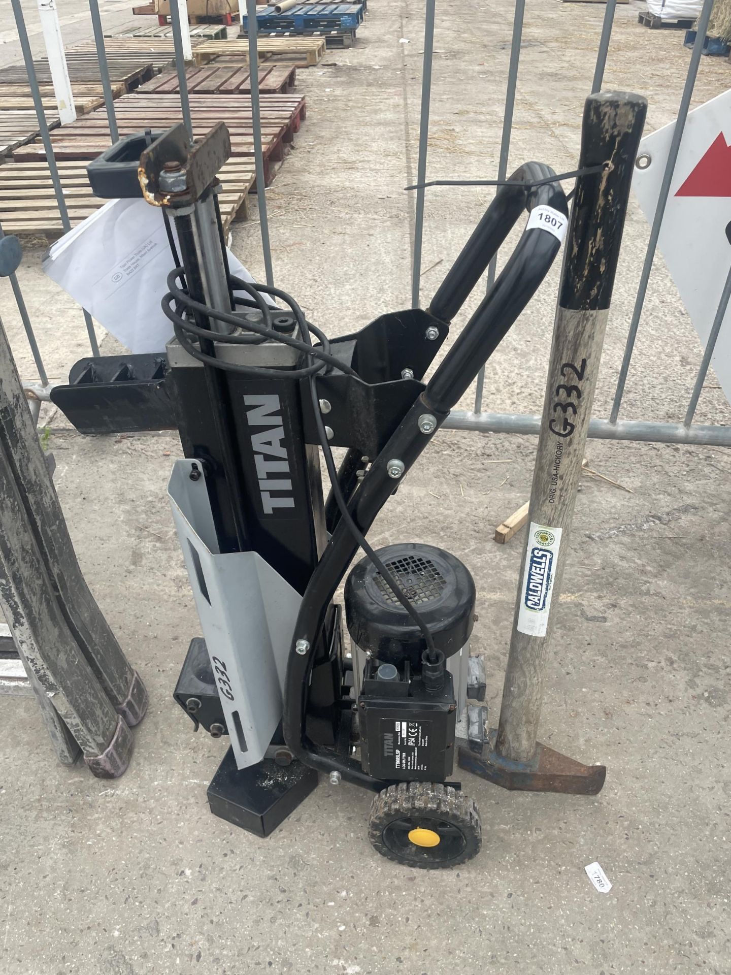 A TITAN TTB685LSP LOG SPLITTER AND AN AXE