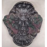 A HEAVY WALL HANGING STONE FACE OF BACCHUS, THE GOD OF WINE AND FRIVOLITY, APPROX 28CM X 28CM