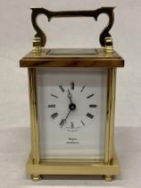 A WATCHES OF SWITZERLAND BRASS CARRIAGE CLOCK