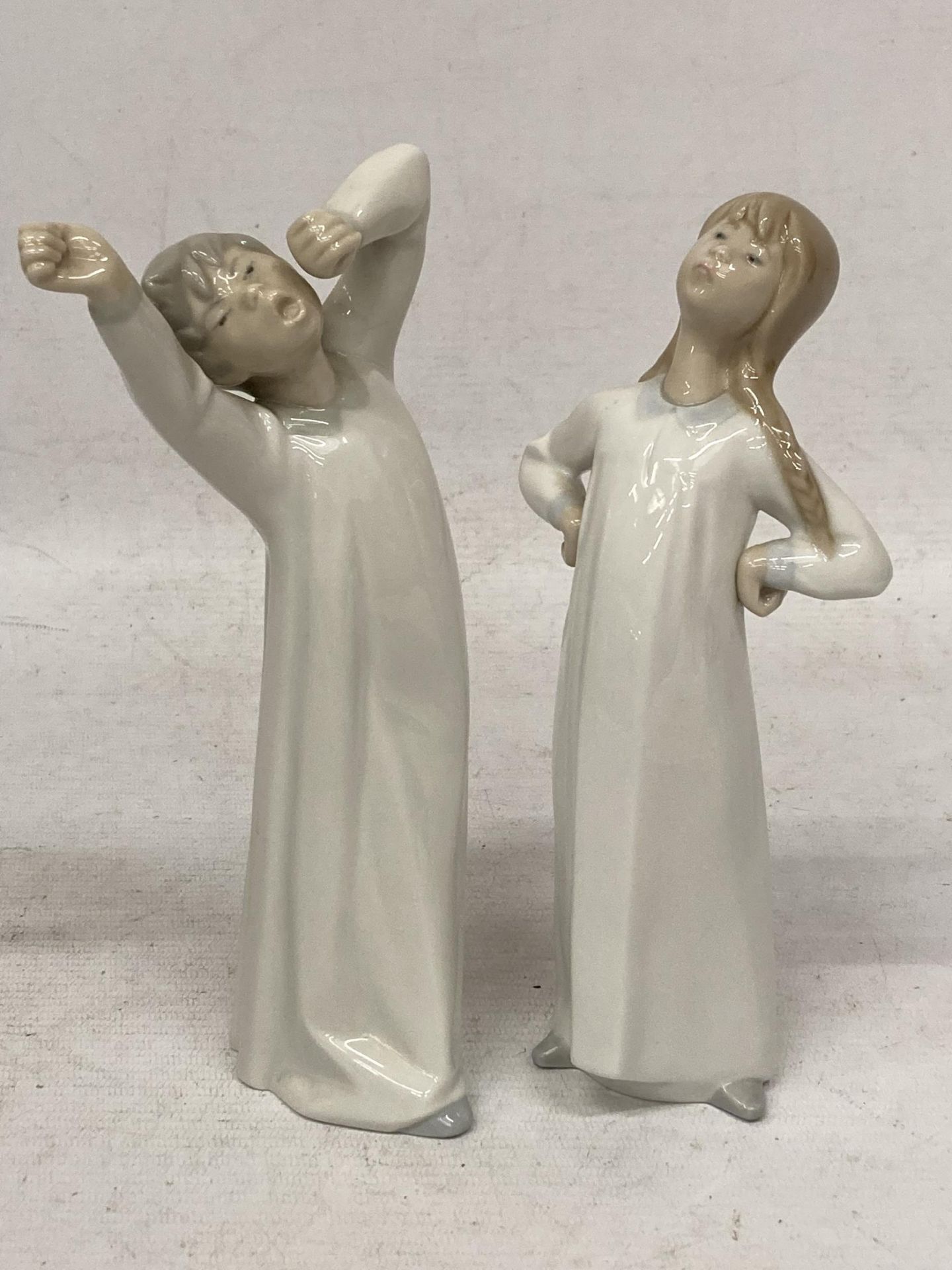 TWO FIGURES OF A GIRL AND BOY - ONE LLADRO, ONE NAO