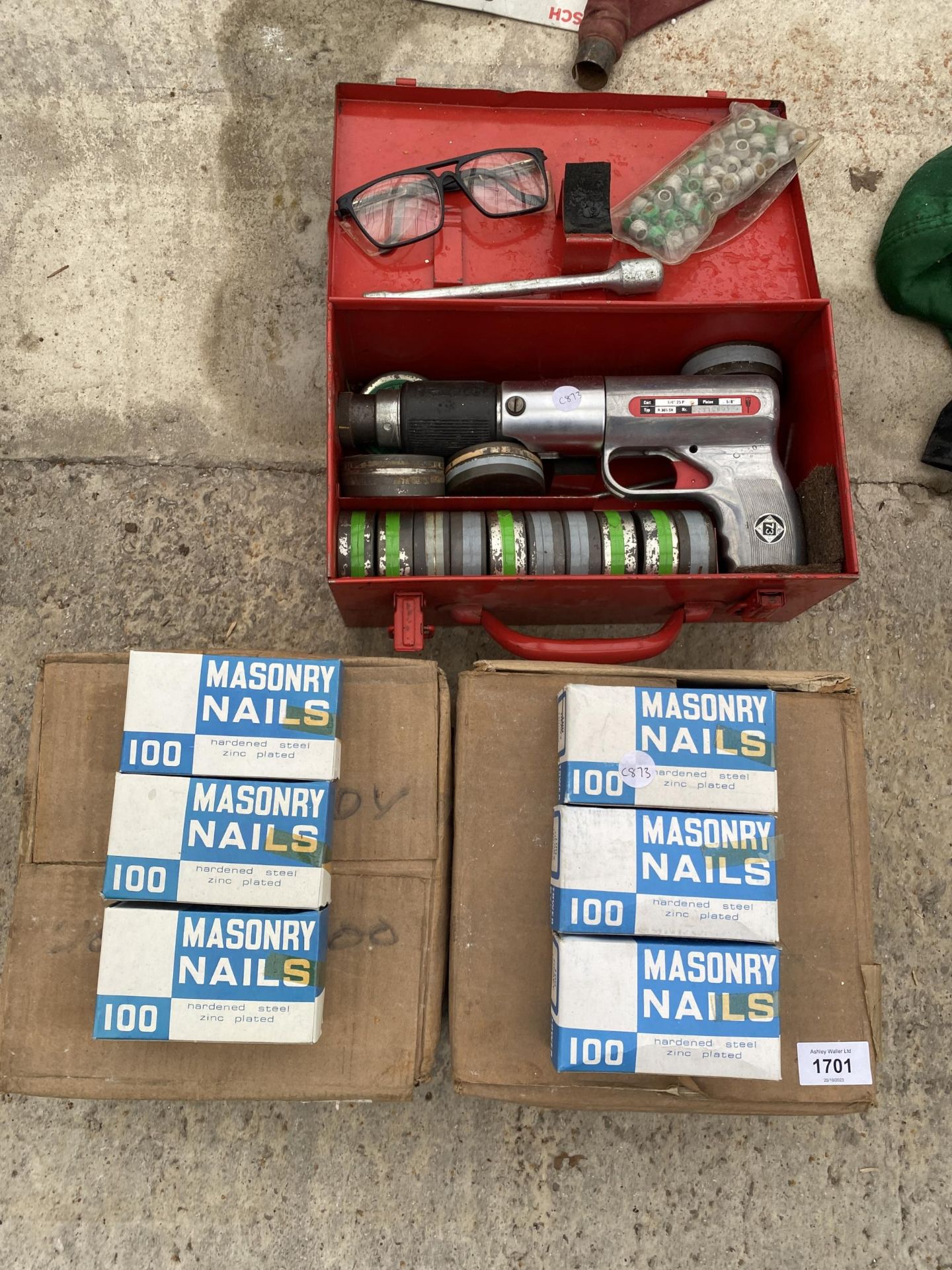 AN ASSORTMENT OF ITEMS TO INCLUDE A NAIL GUN AND A LARGE QUANTITY OF MASONARY NAILS ETC