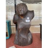 AN ABSTRACT TREEN CARVED FIGURE