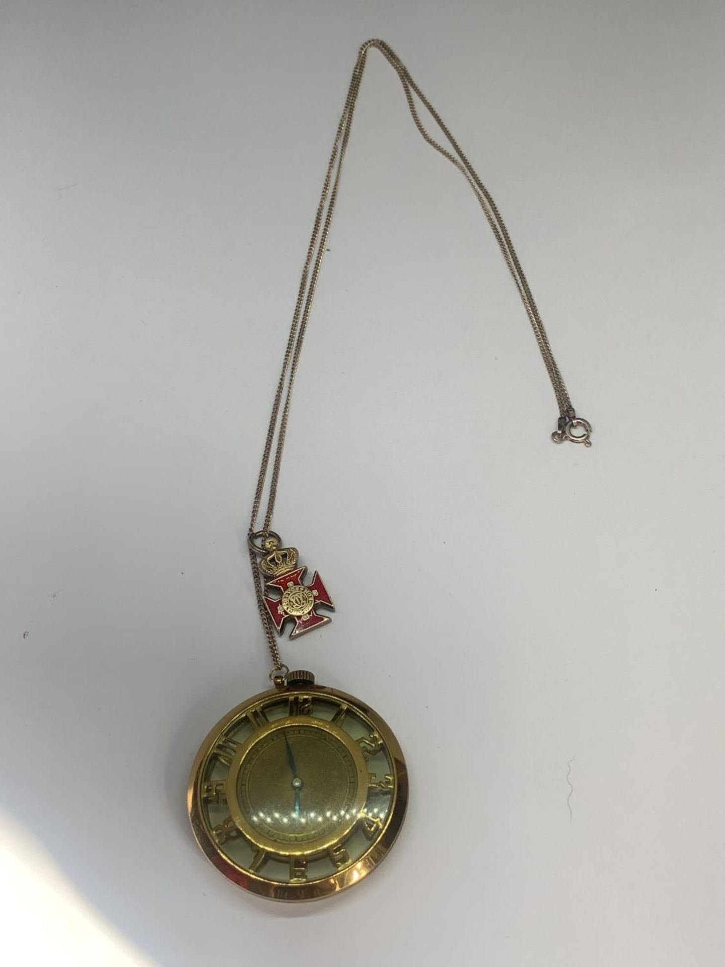 A BOXED SILVER GILT NECKLACE, MEDAL AND PLATE WATCH