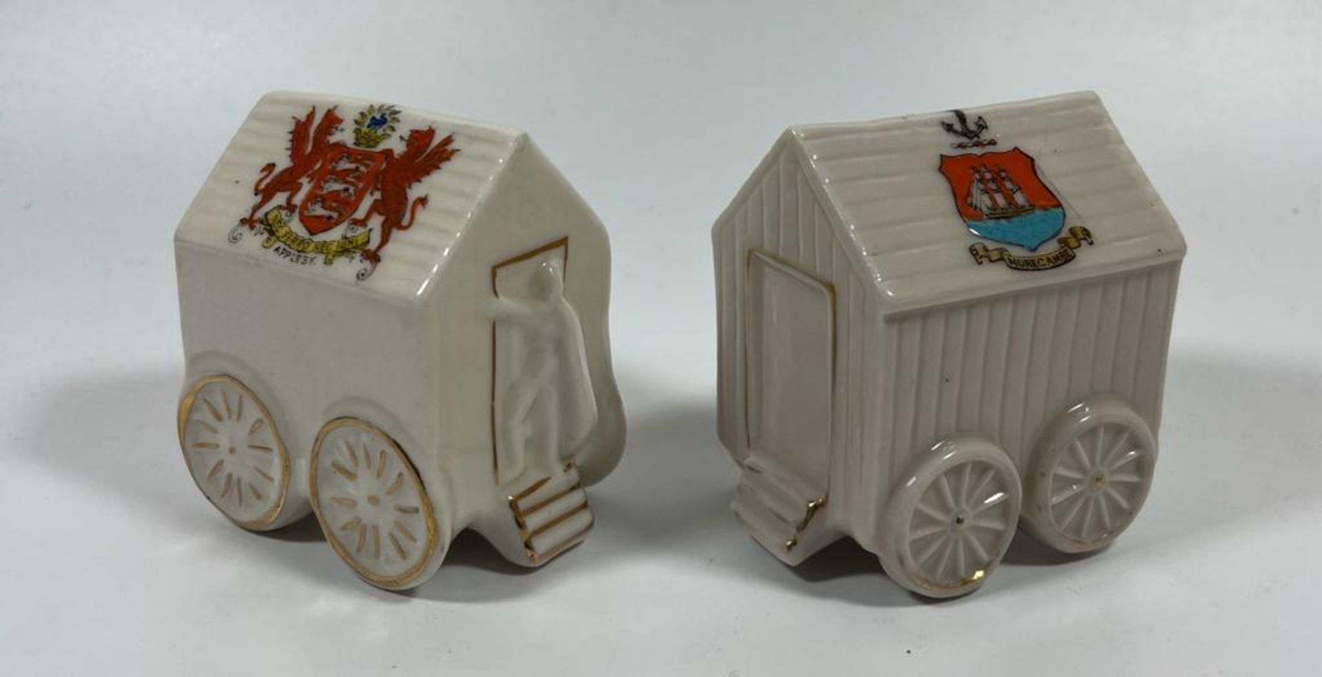 A PAIR OF VINTAGE CRESTED WARE CHINA BATHING HUTS, FLORENTINE & CORONA - MORECAMBE AND APPLESY