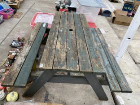 A WOODEN PICNIC BENCH