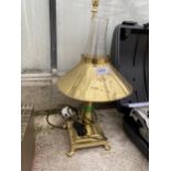 A BRASS ELECTRIC TABLE LAMP WITH LION PAW FEET