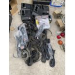 AN ASSORTMENT OF POWER TOOL CHARGERS AND VARIOUS ELECTRIC CABLES ETC