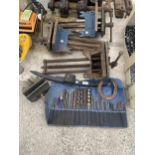 FOUR LARGE BENCH VICES AND AN ASSORTMENT OF DRILL BITS