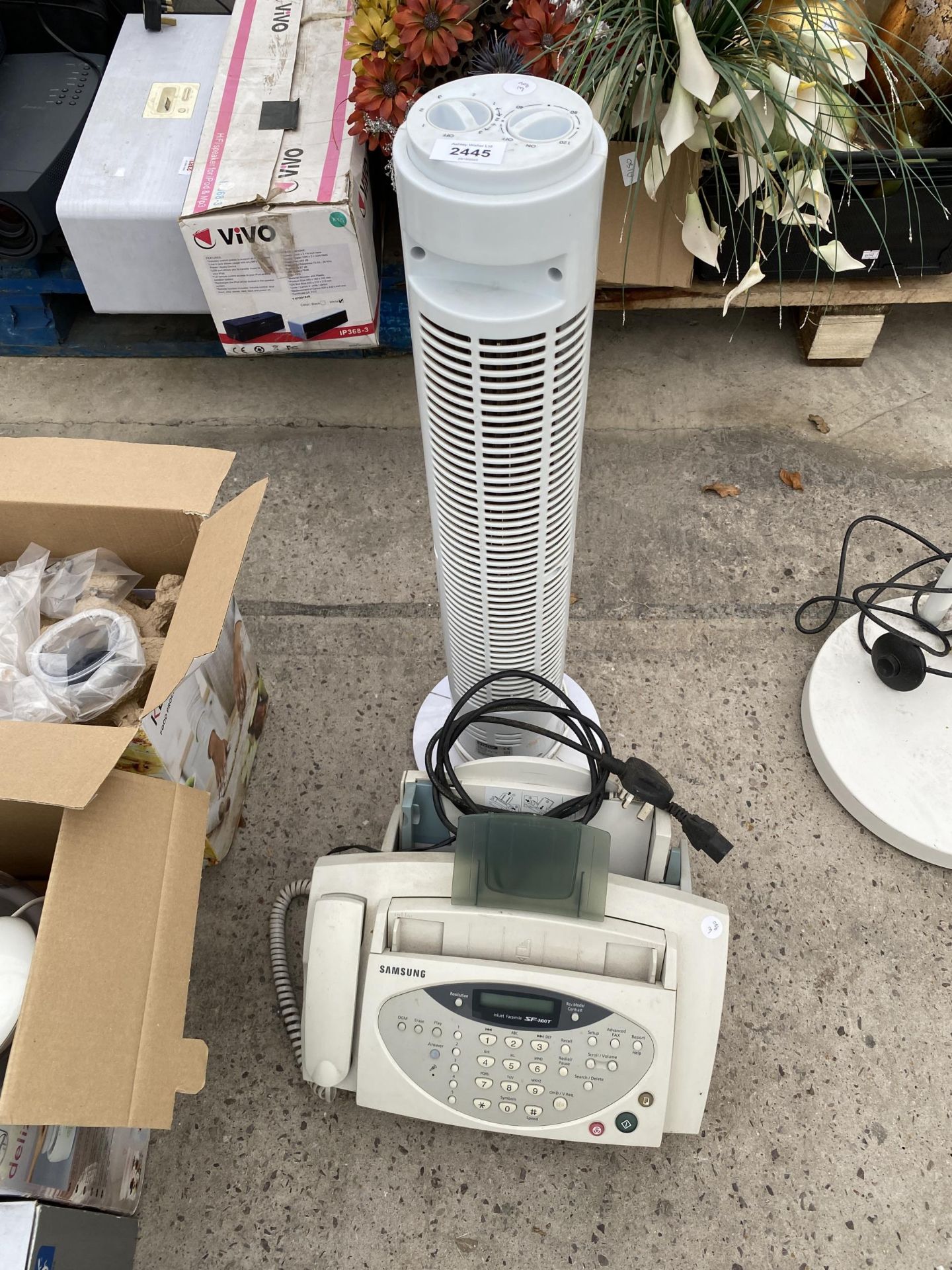 A TOWER FAN AND A SAMSUNG FAX MACHINE