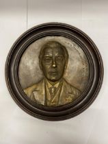 A VINTAGE WOODEN WALL PLAQUE WITH AN IMAGE OF THE RIGHT HON. JOSEPH CHAMBERLAIN (FRED WINTER