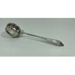 A .99 STAMPED SILVER ANTIQUE SUGAR SIFTER, LENGTH 18.5 CM