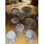 A QUANTITY OF CROWN STAFFORDSHIRE DINNERWARE TO INCLUDE SOUP COUPES AND SAUCERS, PLATES, A SERVING